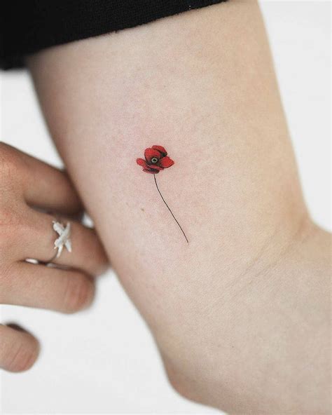 tiny poppy flower tattoo